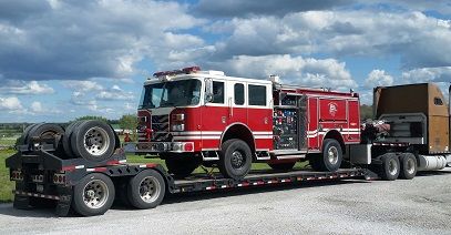 alt= "Image of fire truck hauling"